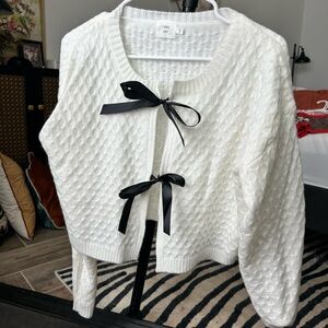 Elegant White Cardigan with Black Ribbon Accents